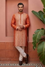 Rust colour kurta set with allover embroidered