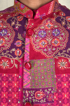 Plain red kurta set with mirror work and embroidered jacket