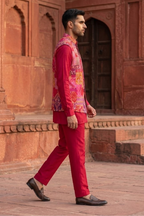 Plain red kurta set with mirror work and embroidered jacket