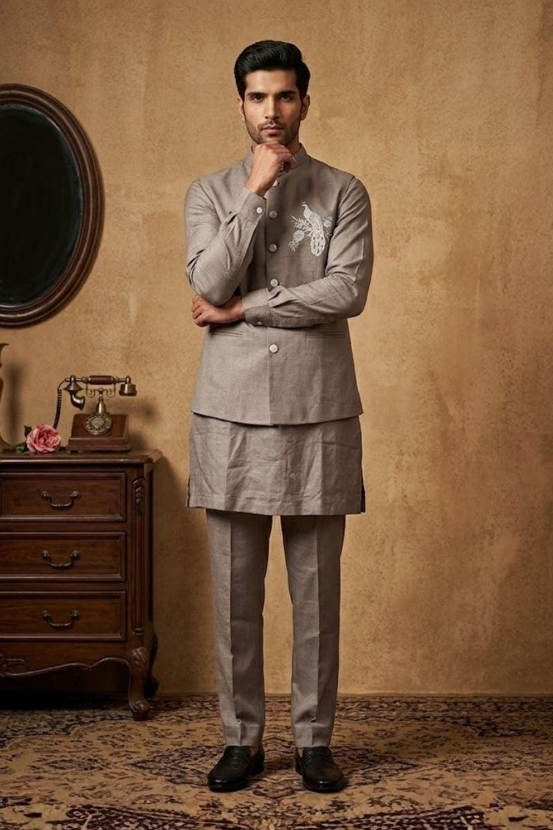 Grey plain kurta set with detailed hand embroidery of a peacock and minimal neck work bundi