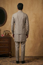 Grey plain kurta set with detailed hand embroidery of a peacock and minimal neck work bundi