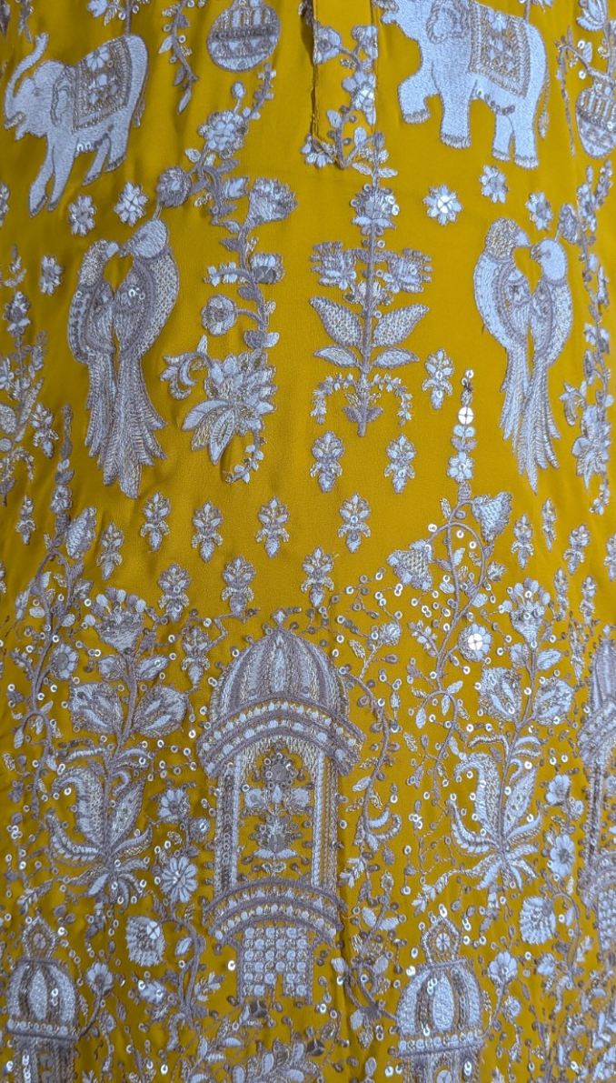 Yellow colour georgetta fabric kurta top with allover thread embroidery with pant