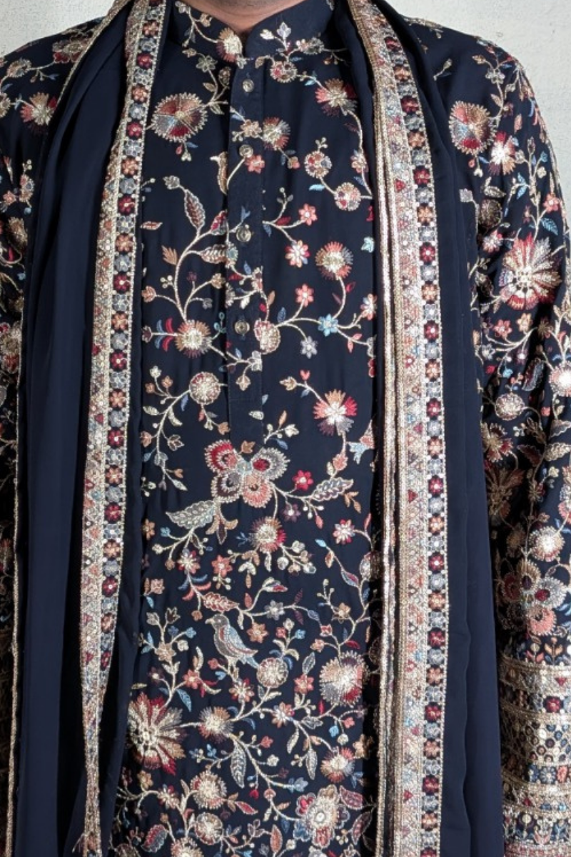 Black colour kurta top and dupatta with allover colourful thread work and pant