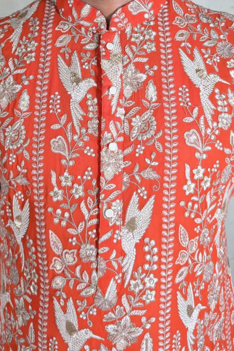 Orange colour kurta top with allover embroidery