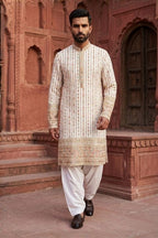 White colour kurta set with thread work and mirror work