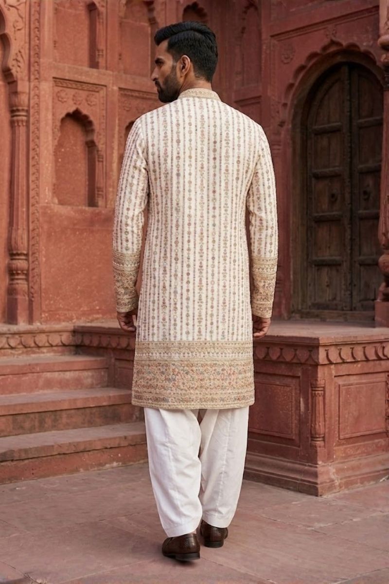 White colour kurta set with thread work and mirror work
