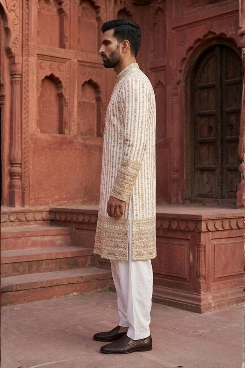 White colour kurta set with thread work and mirror work