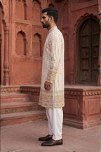 White colour kurta set with thread work and mirror work
