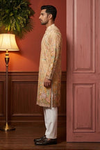 Cream colour kurta pant with floral and architectural design embroidery