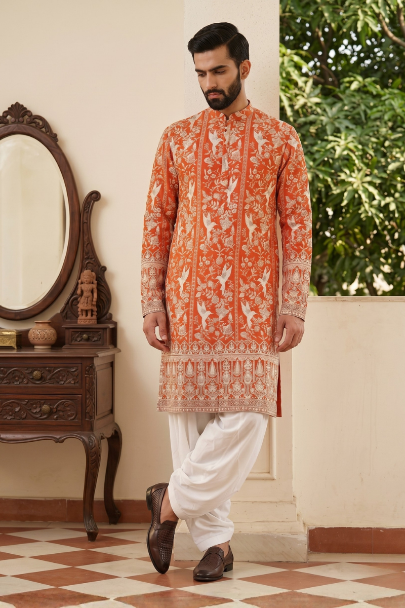 Orange colour kurta top with allover embroidery