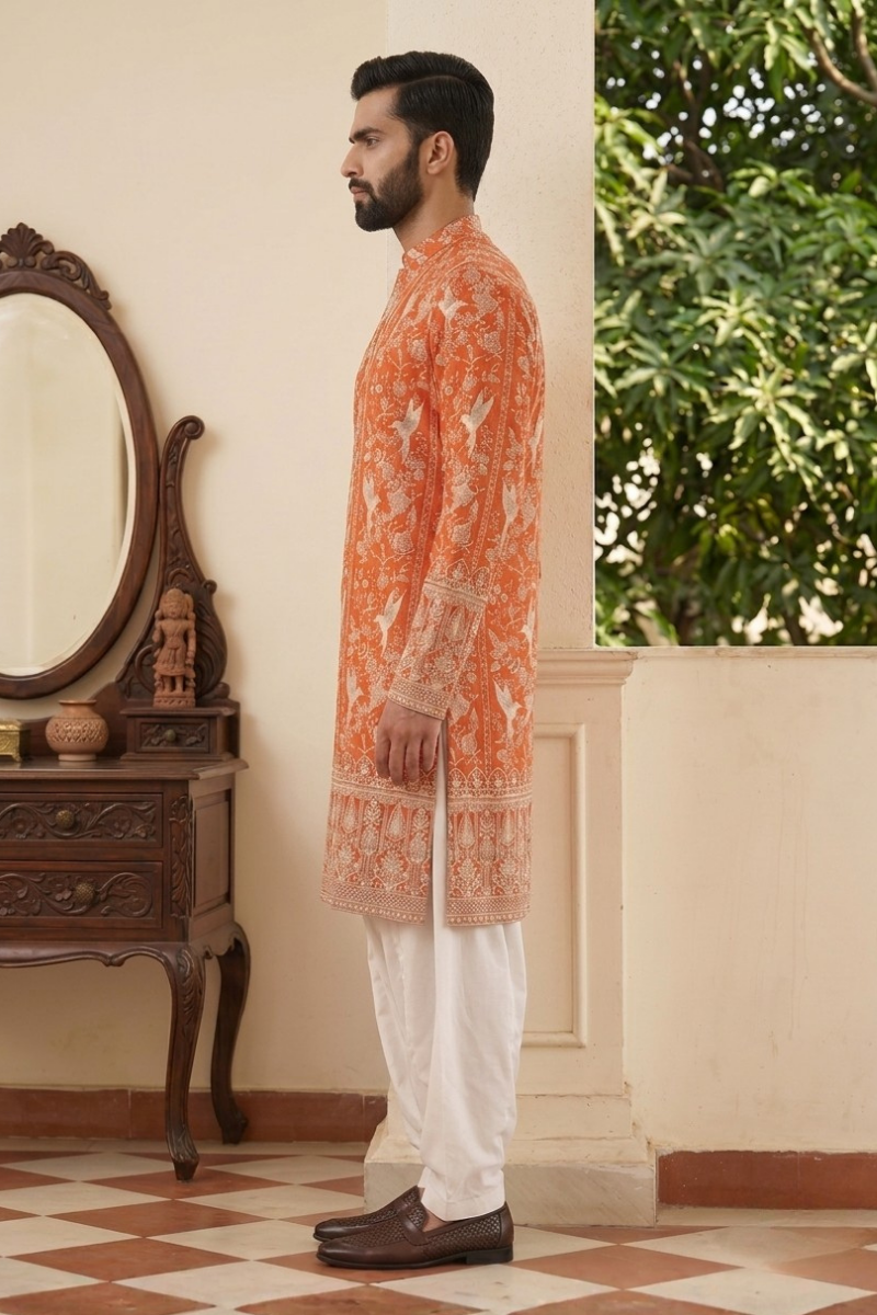 Orange colour kurta top with allover embroidery