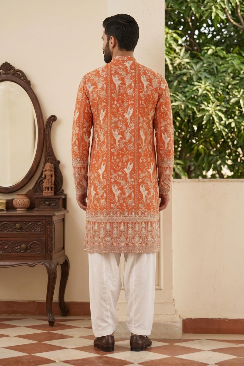Orange colour kurta top with allover embroidery