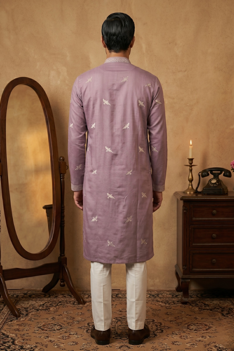 Purple colour kurta top with thread work with pant