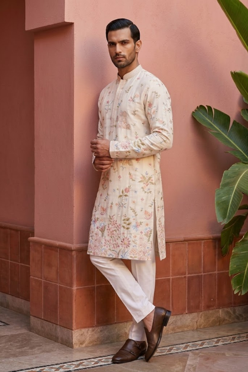 White colour kurta top with thread work and pant