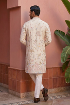 White colour kurta top with thread work and pant