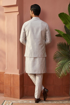 Light grey kurta set with mirror and thread work bundi