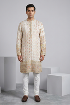 White colour kurta top with thread work and mirror work