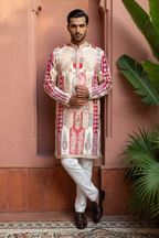Royal Zari Motif Kurta Ensemble Ethnic kurta likely made of cotton or a similar kurta featuring intricate red and white patterns and embellishments kurta set