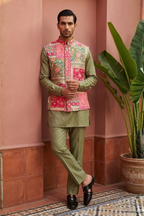 Plain green colour kurta set with mirror work and embroidered jacket
