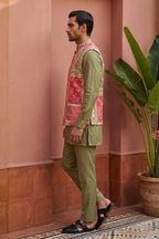 Plain green colour kurta set with mirror work and embroidered jacket