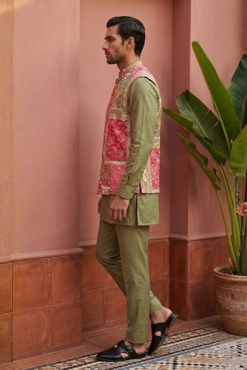 Plain green colour kurta set with mirror work and embroidered jacket