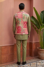 Plain green colour kurta set with mirror work and embroidered jacket