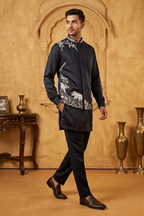 Blue kurta set with detailed white  embroidery of floral patterns and an elephant in bundi