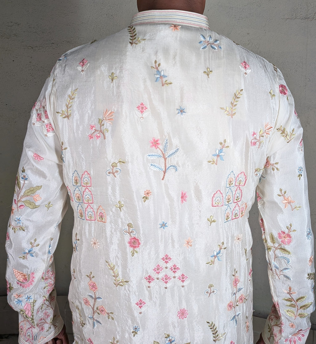 White colour kurta top with thread work and pant