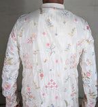 White colour kurta top with thread work and pant