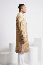 Cream colour kurta top with floral and architectural design embroidery
