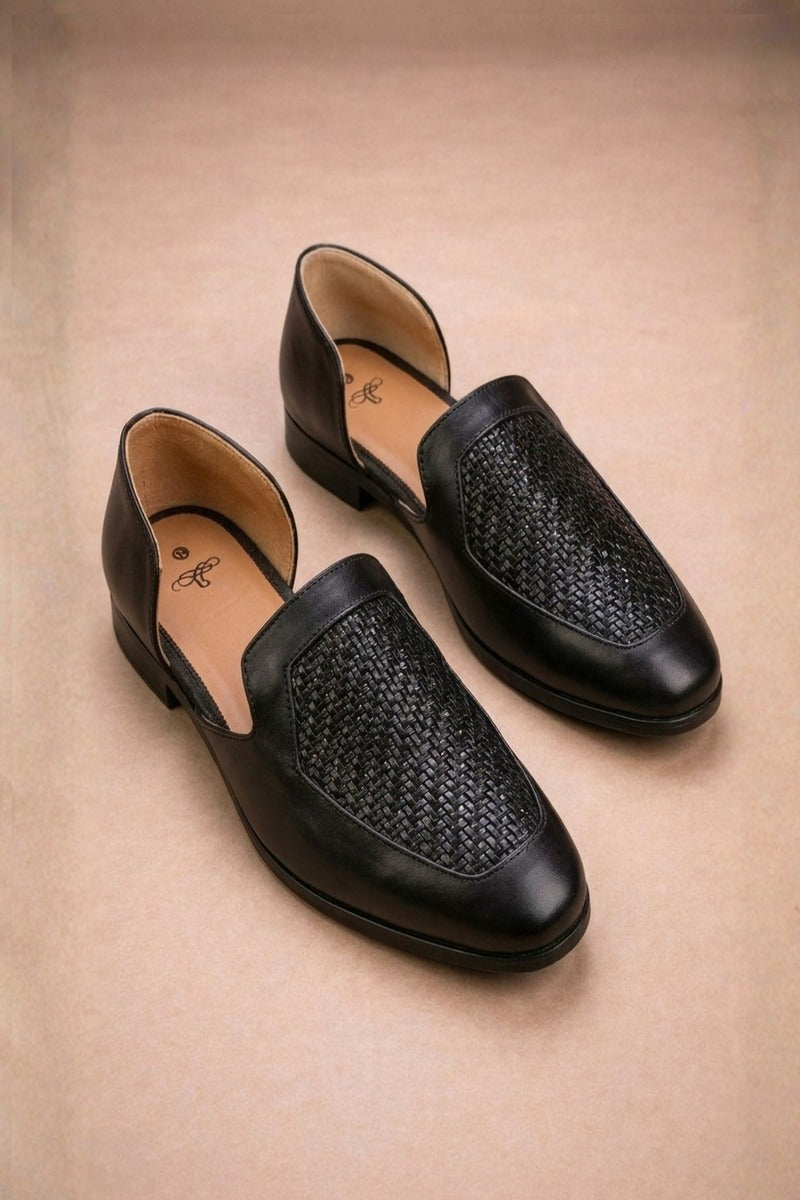 Black leather peshawari sandals with a woven texture on the vamp