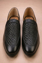 Black leather peshawari sandals with a woven texture on the vamp