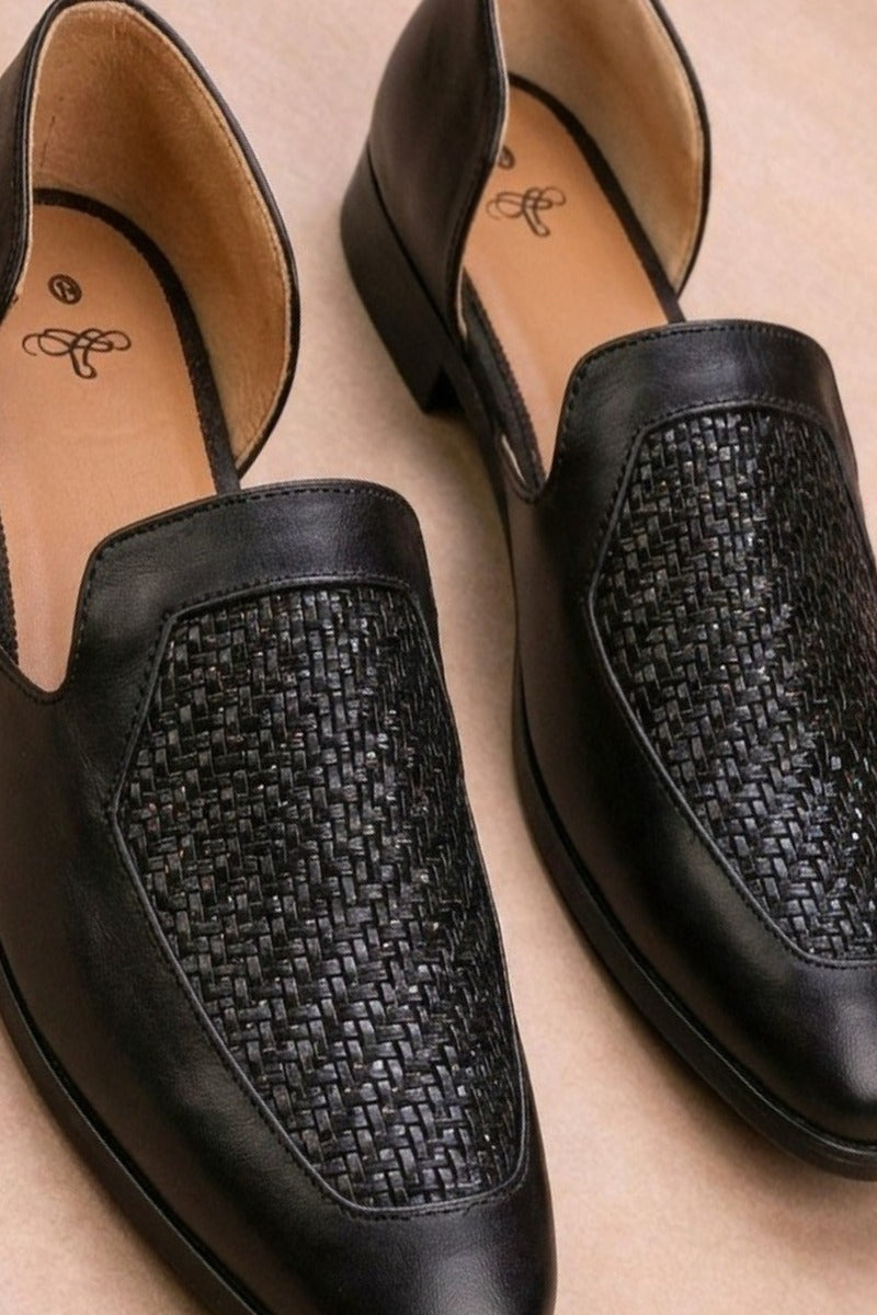 Black leather peshawari sandals with a woven texture on the vamp