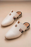 Pair of cream quilted leather backless mules with a gold-tone embellishment