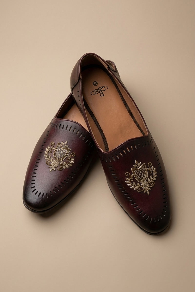 Pair of wine leather sandals with gold embroidery