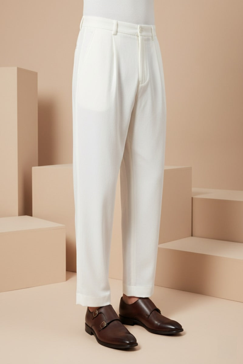 Cream colour bell bottom pant Structured waistband with button closure
Soft, comfortable fabric
Subtle front pleats
Straight-leg silhouette