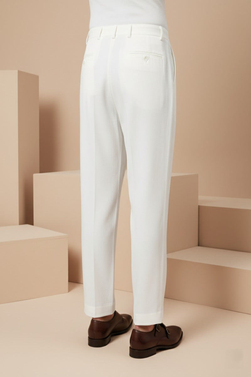 Cream colour bell bottom pant Structured waistband with button closure
Soft, comfortable fabric
Subtle front pleats
Straight-leg silhouette