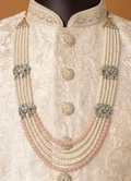 Five-line groom's mala featuring white and peach beads with elephant motifs