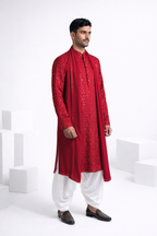 Rani colour kurta top and dupatta with allover thread and mirror work