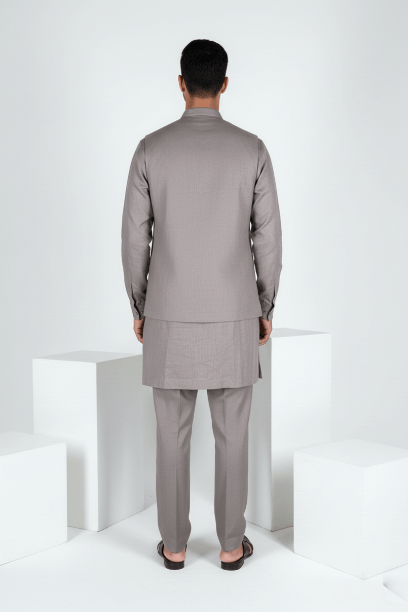 Grey plain kurta set with detailed hand embroidery of a peacock and minimal neck work bundi